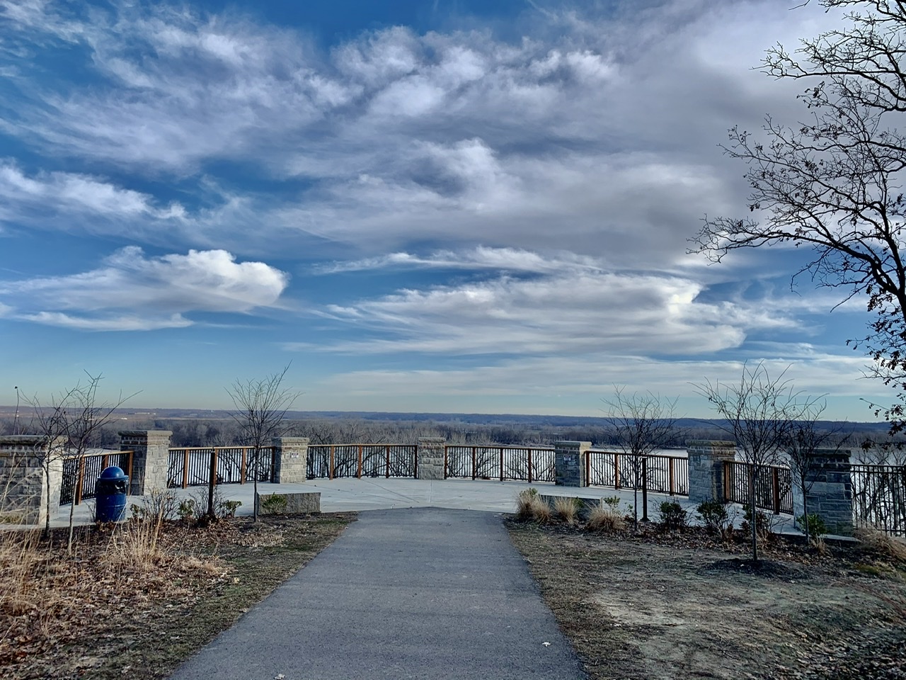 Clouds and blue sky above overlook at Cliff Cave Park